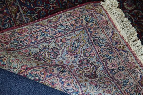 A Kashan red ground carpet, 10ft 2in by 7ft 10in.